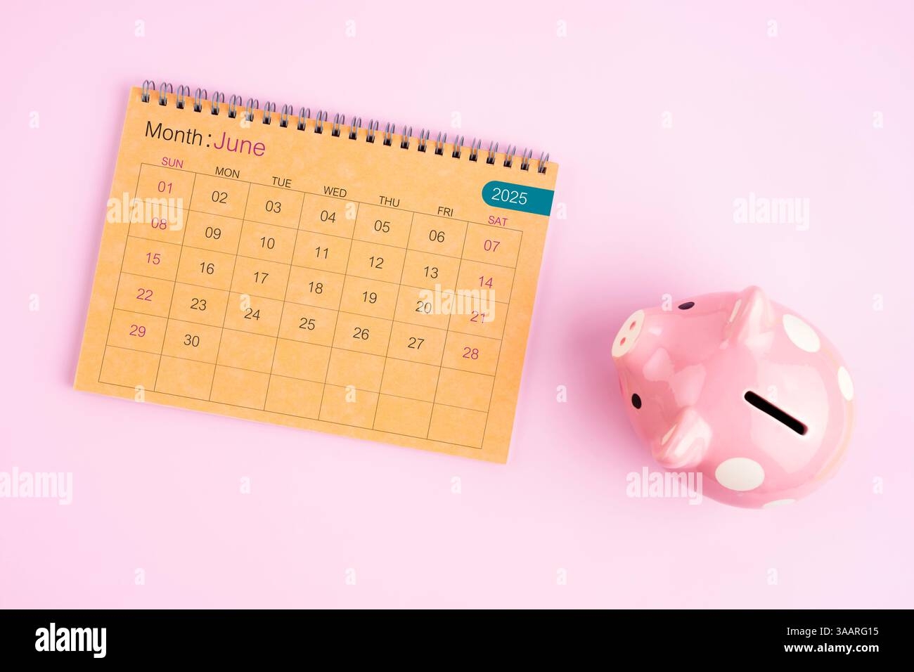 Top View Of June 2025 Desk Calendar And Pencil On Yellow And Black 